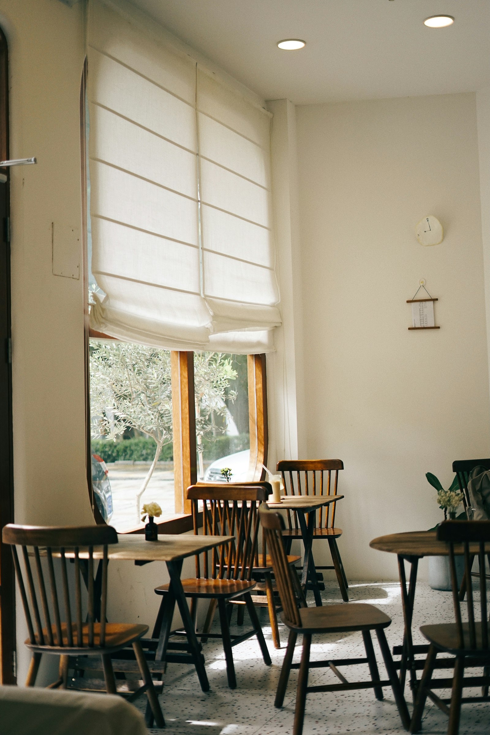Warm morning light falling across the cafe tables